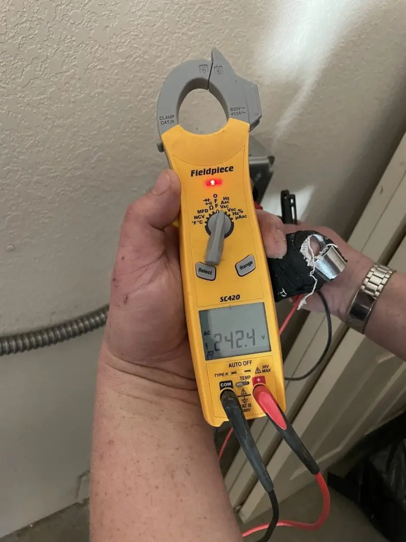 Voltage testing with clamp meter during Electrical Installation Services in Clifton Forge